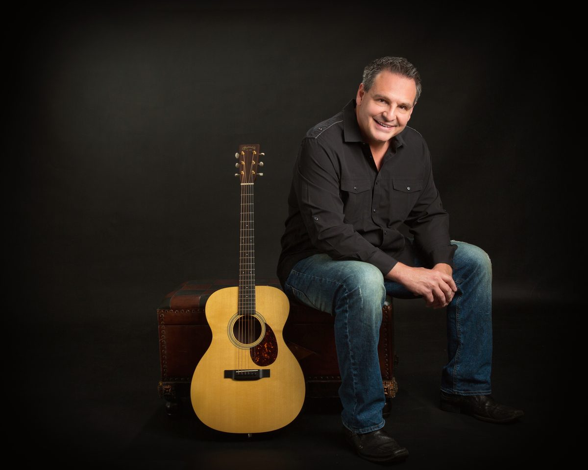 Jim Botsford with his Martin acoustic guitar